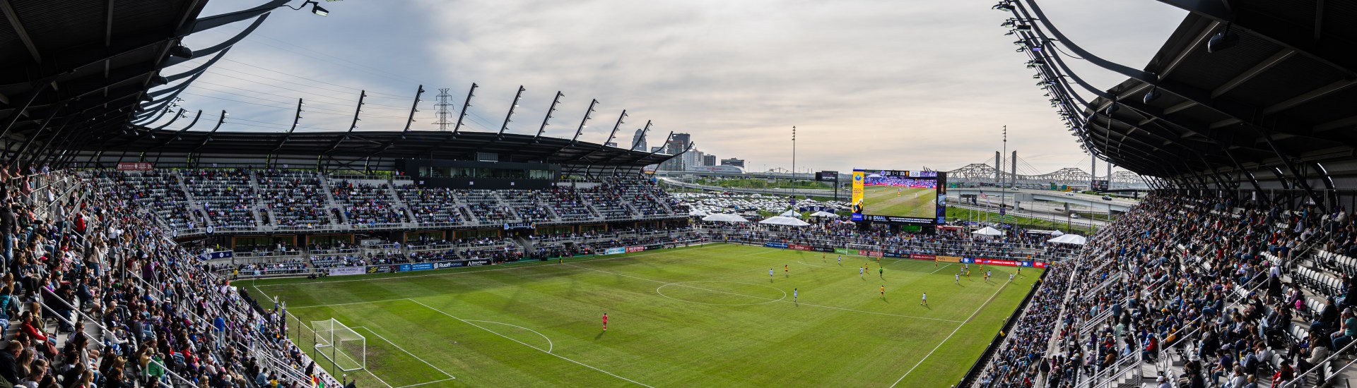 A stadium filled with people for a soccer game.