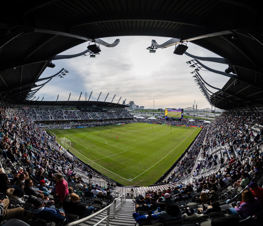 A stadium filled with people for a soccer game.